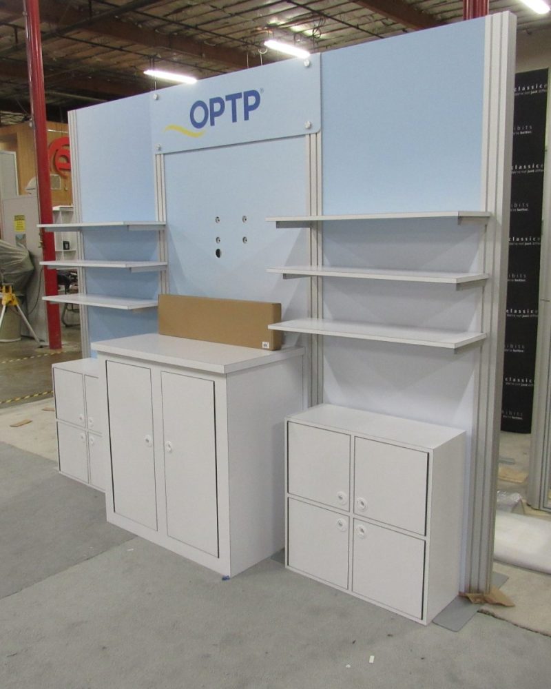 Example 10’ Inline modular retail shelving exhibit with locking storage cabinets and cubbies.